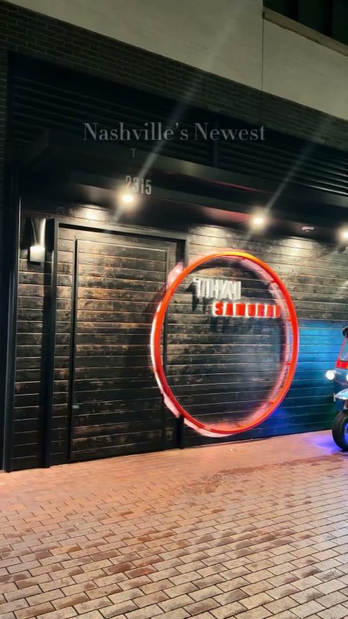 Restaurant spotlight: Thai Samurai's storefront at night, its red ring sign glowing, under the caption Nashville's Newest