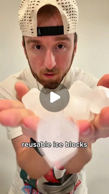 Product demo: Sam holding a handful of reusable ice blocks up to camera, captioned reusable ice blocks