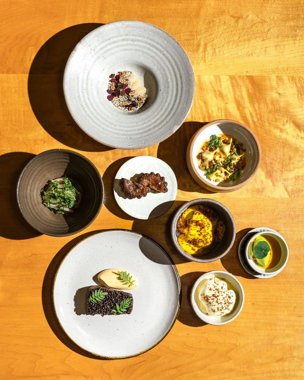 Tasting menu spread of small plates, Bastion Nashville