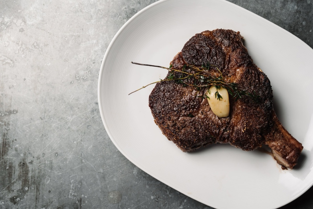 Bone-in steak with herbs and roasted garlic, C. Ellet's Steakhouse
