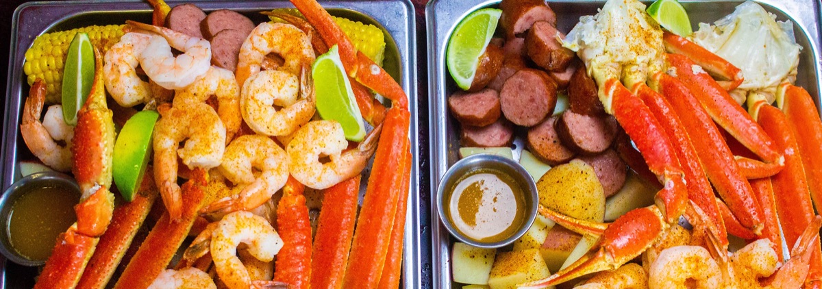 Steamed seafood trays with snow crab, shrimp, sausage, corn and potatoes, Local Steamer Seafood Market
