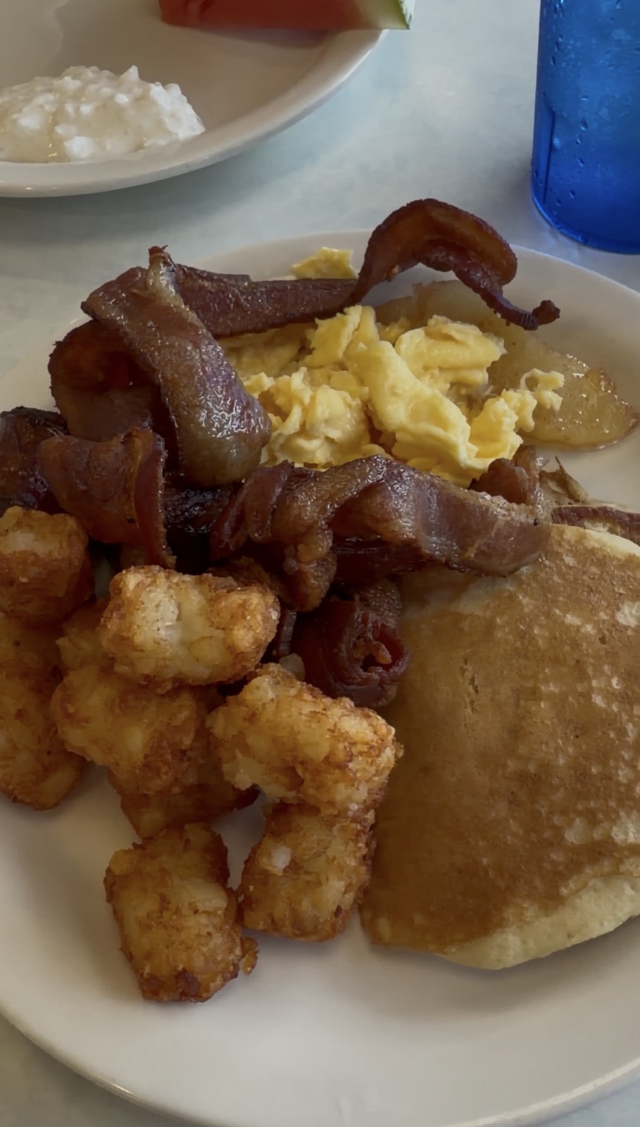 Sam's order: the All-American Diner Spread with bacon, scrambled eggs, tater tots and a pancake