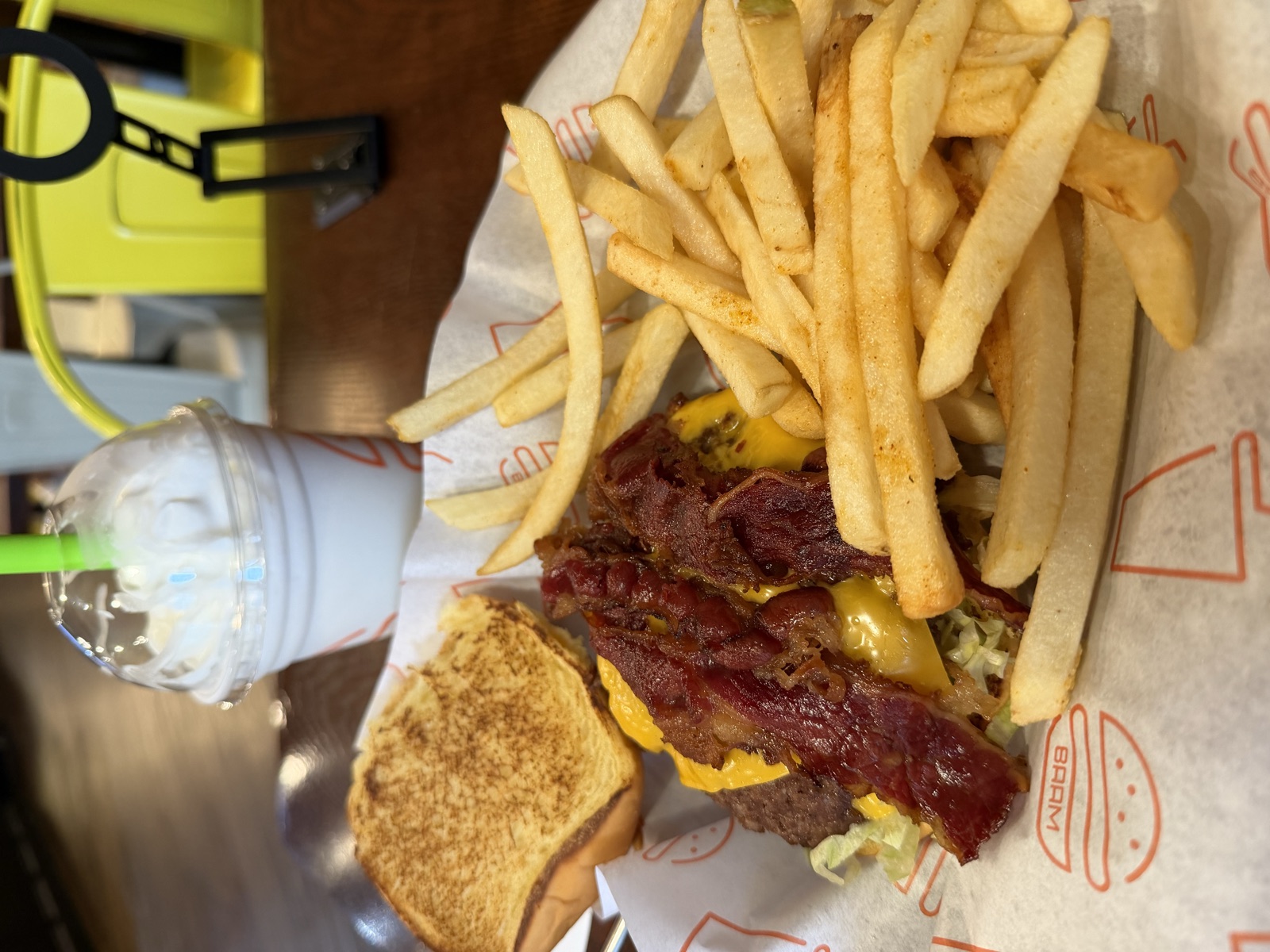 Sam's order: Baam burger with bacon and cheese, fries, and a vanilla milkshake