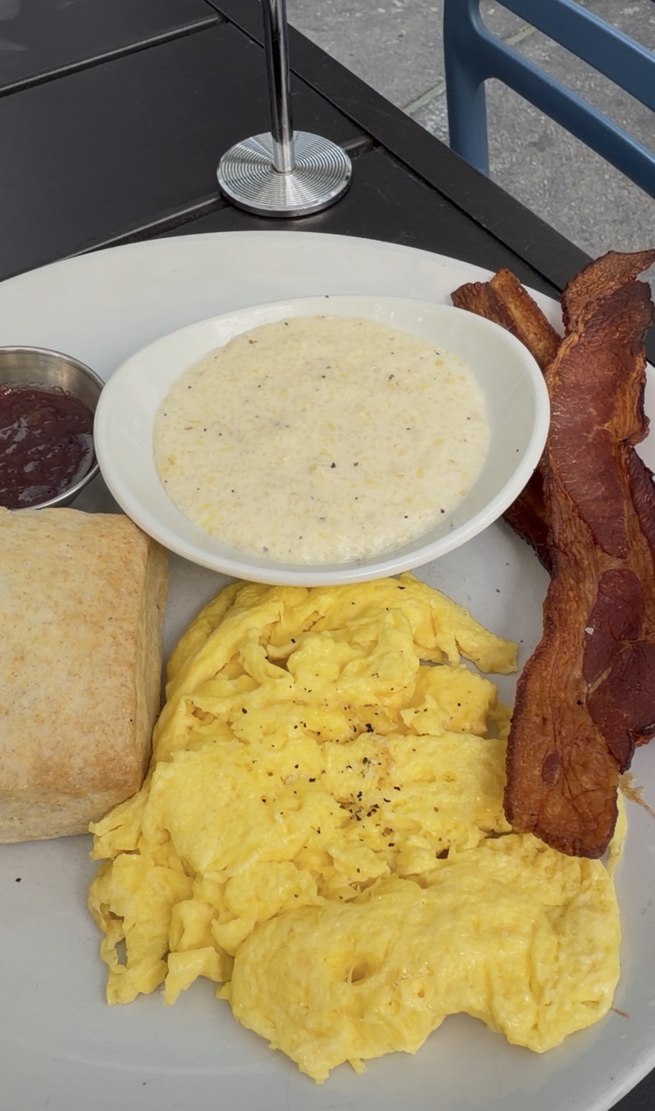 Sam's order: the Egg Plate with scrambled eggs, bacon, grits, and a biscuit, Biscuit Love
