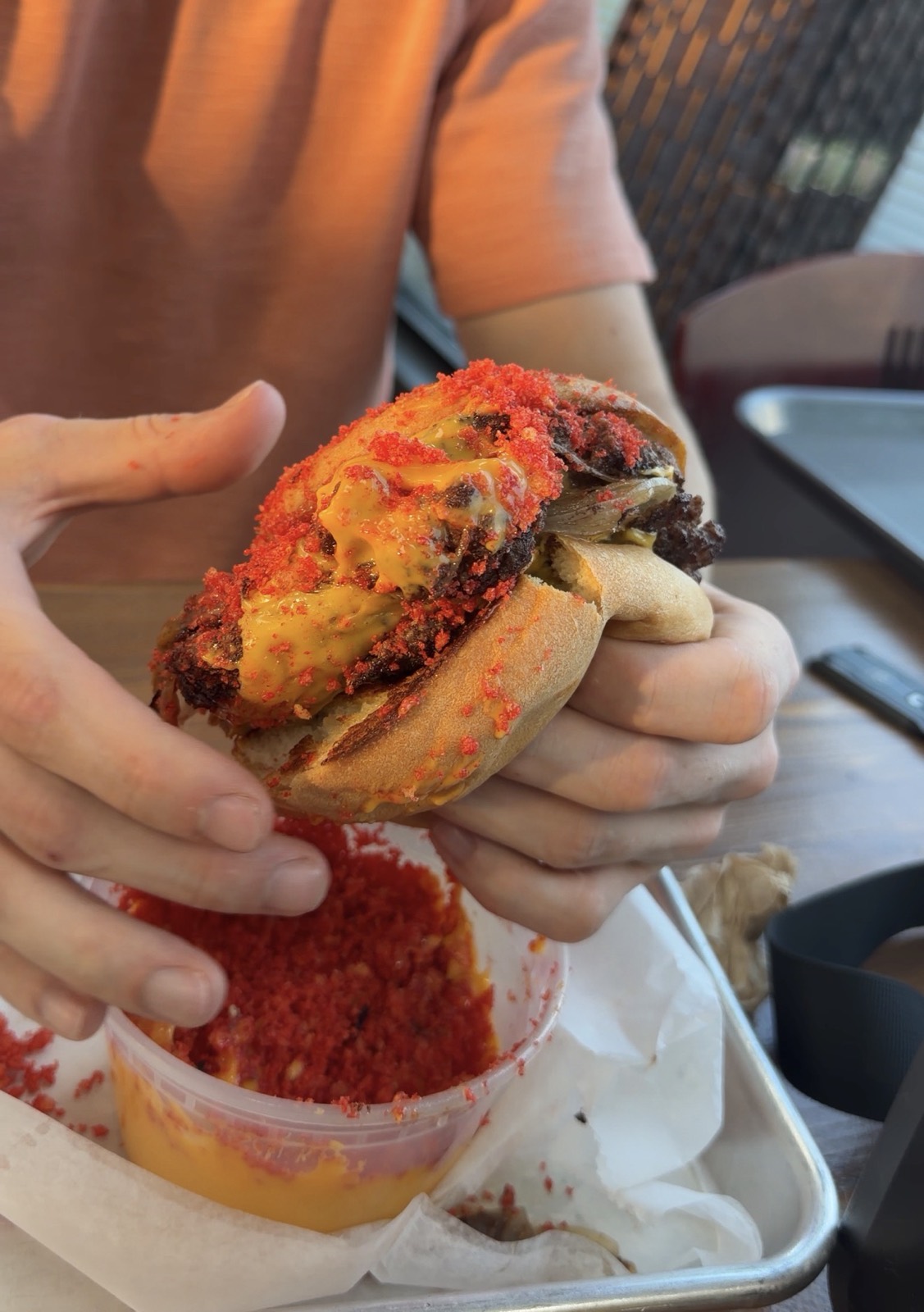 Sam's order: the Hot Nacho Smash Burger, crusted in red chip crumbs and dipped into nacho cheese