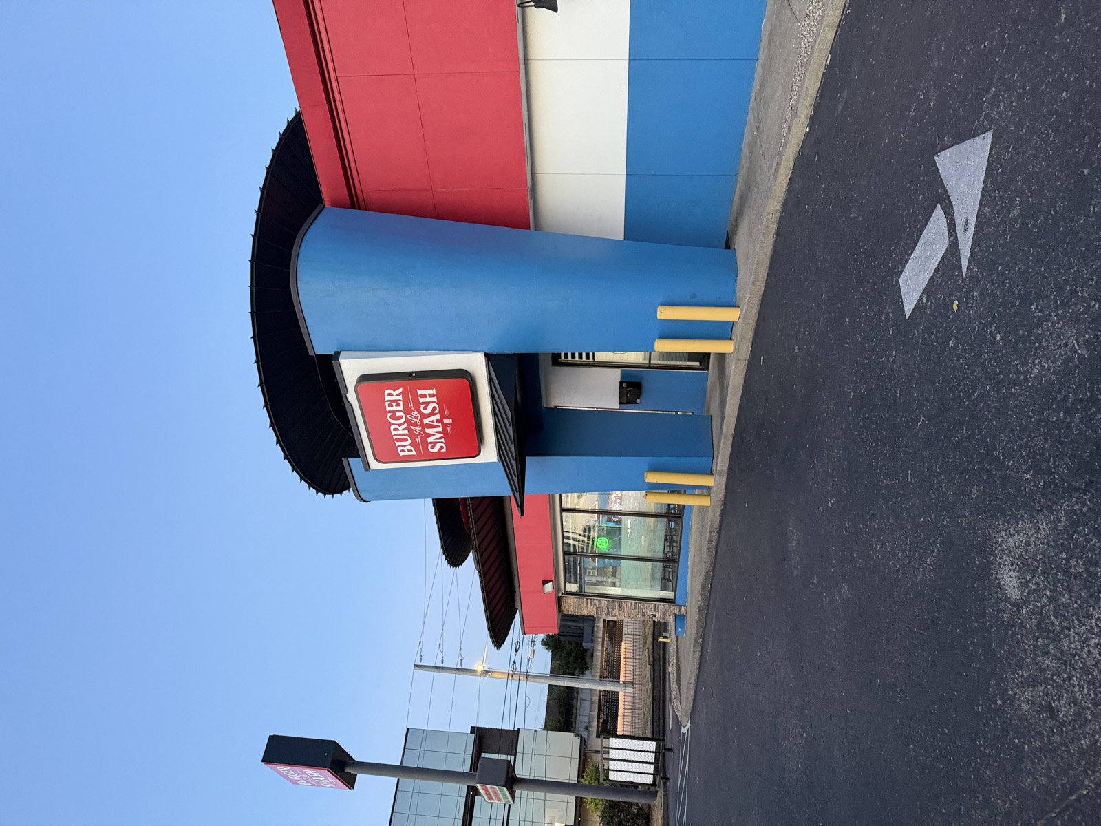 Burger A La Smash's exterior on Murfreesboro Pike, a red, white and blue building with the logo above the entrance