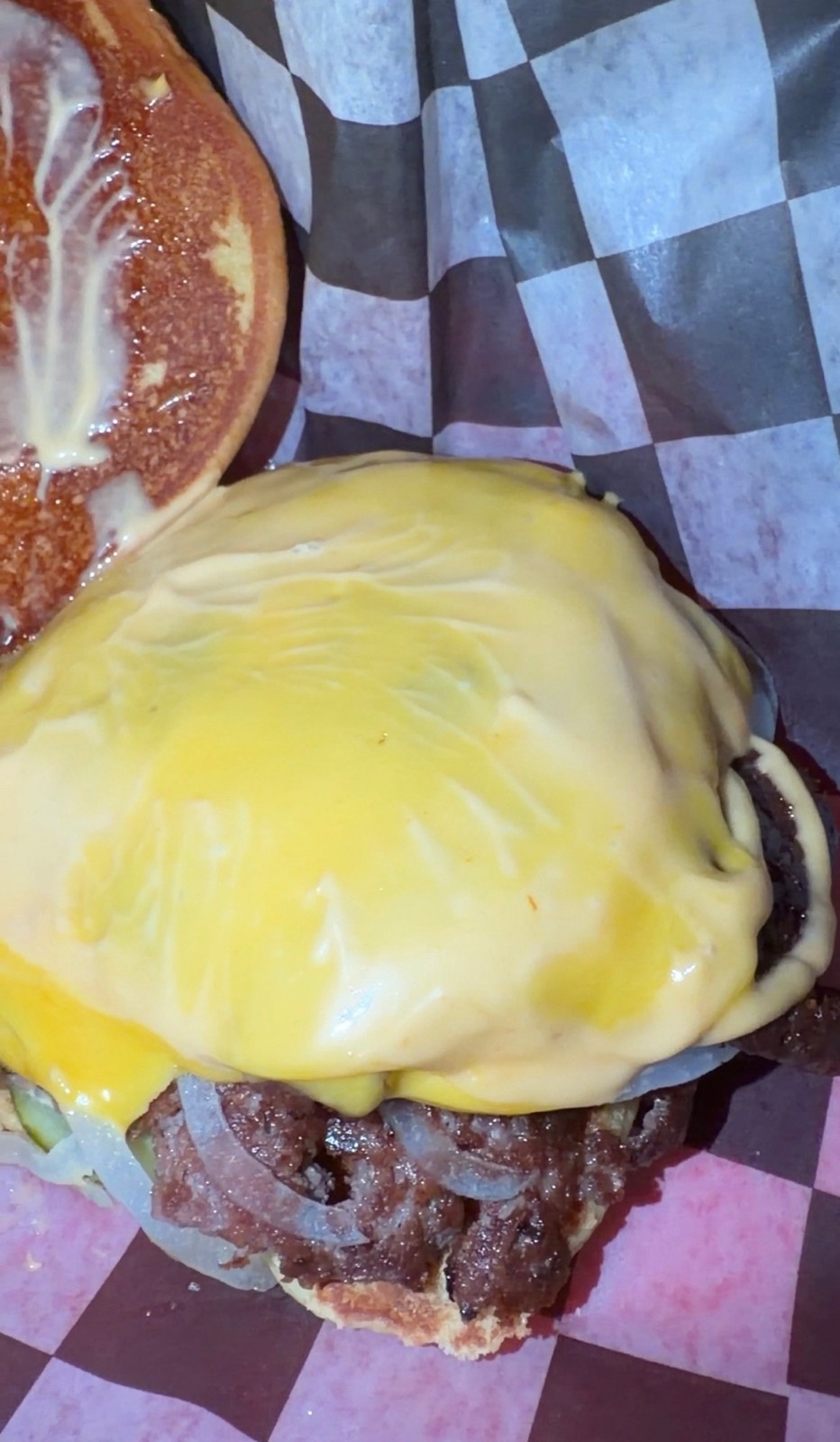 Sam's order: the Smash Burger under a melted slice of American cheese on a toasted bun