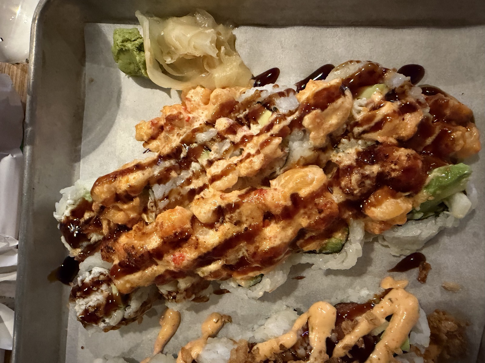 Sam's order: the Seafood Volcano Roll topped with baked spicy seafood and eel sauce