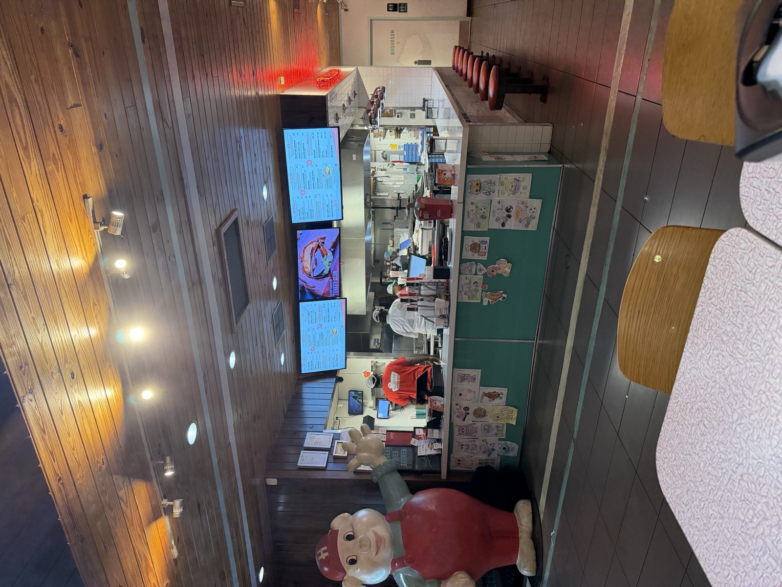 Inside Hugh-Baby's, counter and menu boards