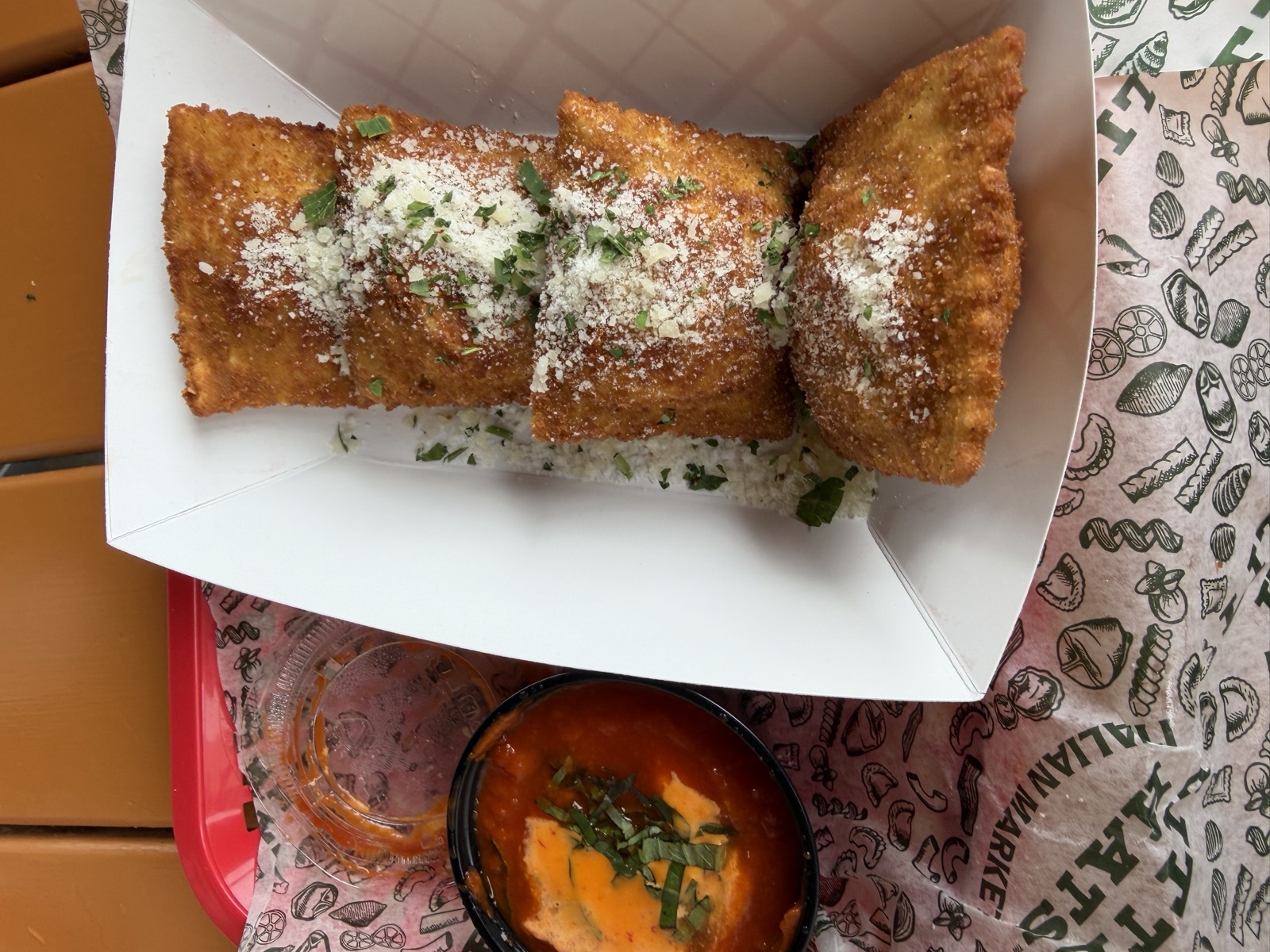 Sam's order: Crispy Ravioli dusted with parmesan and parsley, with a cup of marinara