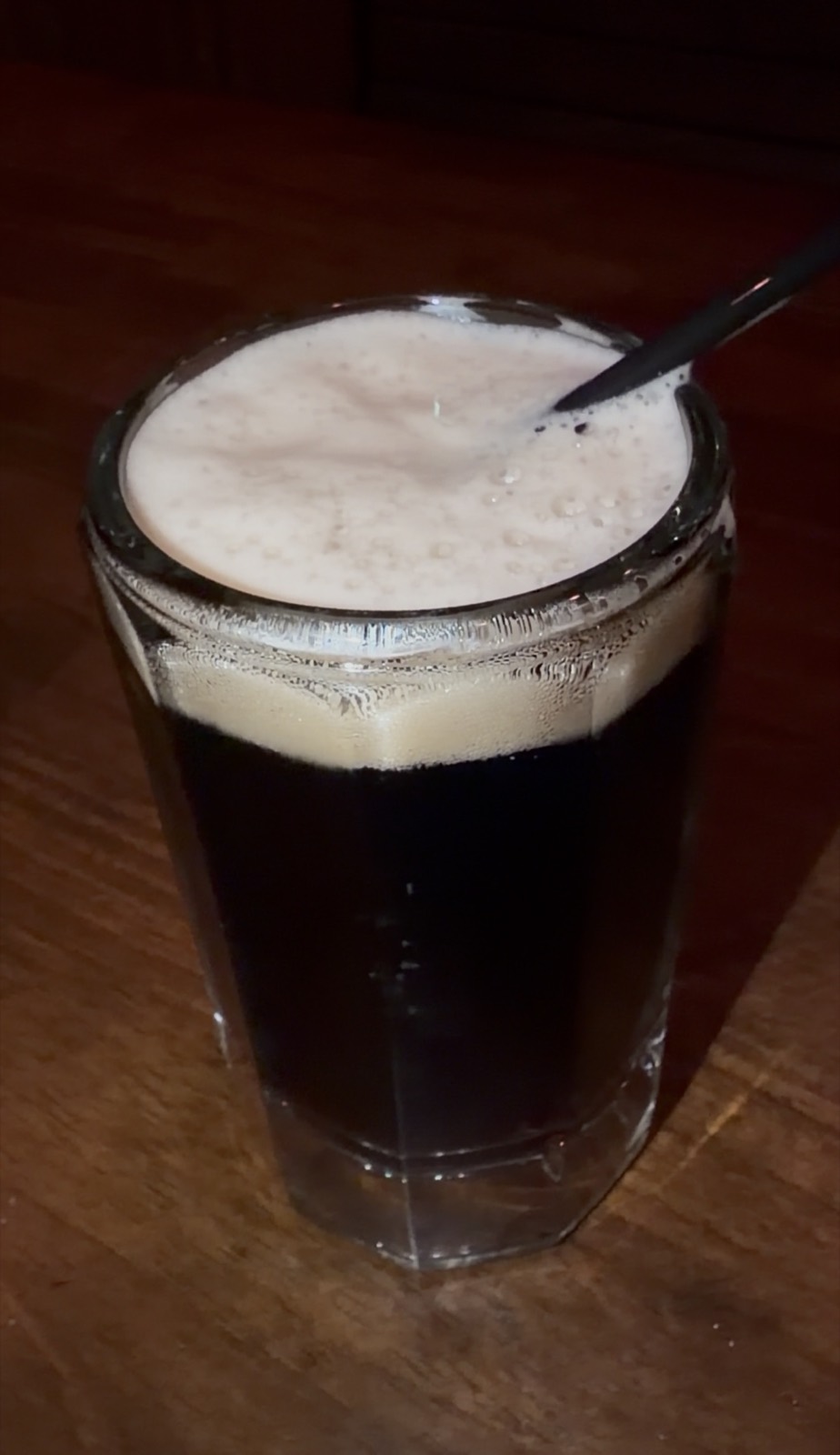 Sam's drink: a glass of McGuire's house root beer with a thick foam head, McGuire's Irish Pub
