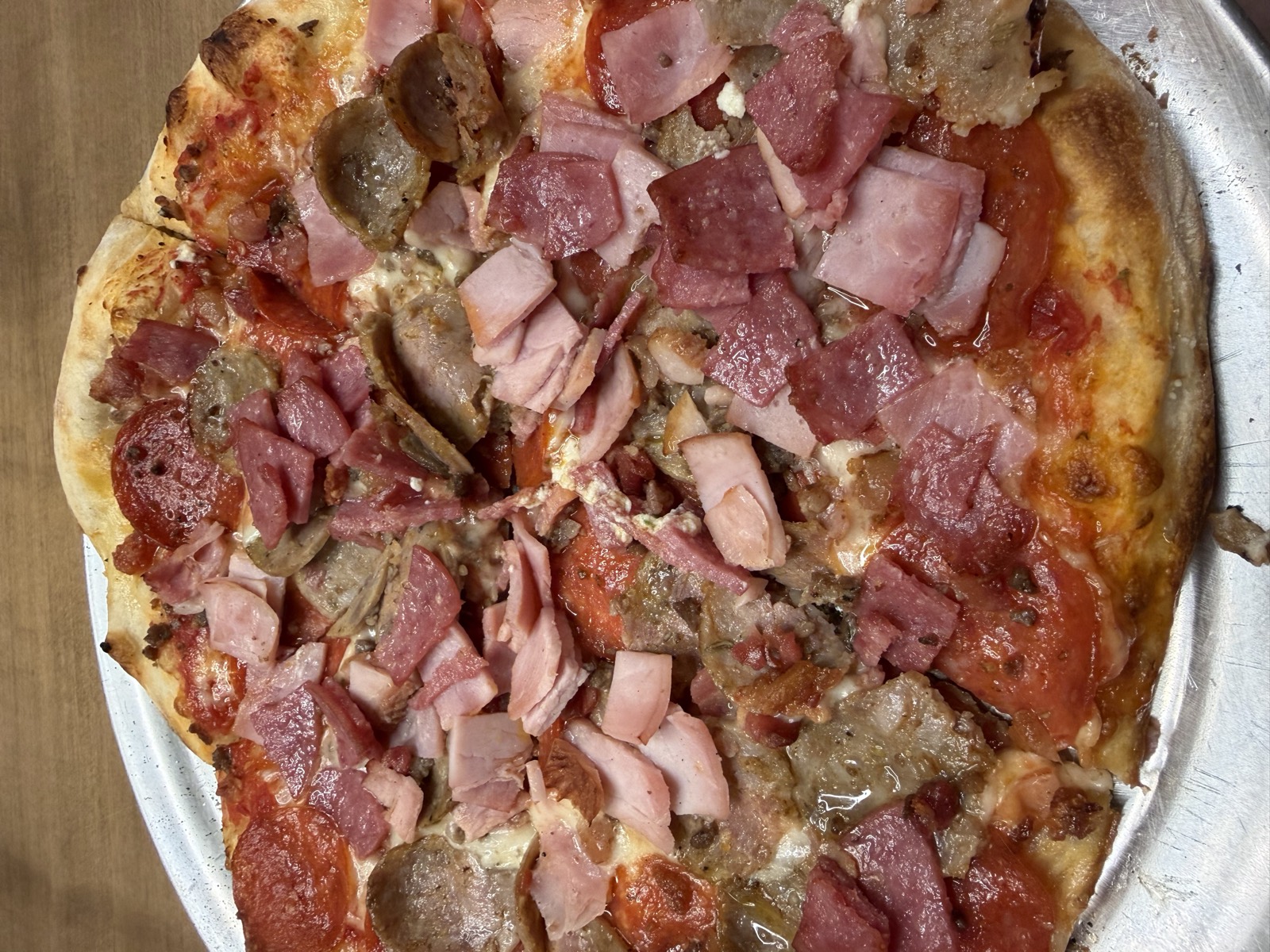 Sam's order: the 10-inch NY Meat pizza loaded with ham, salami, sausage and pepperoni