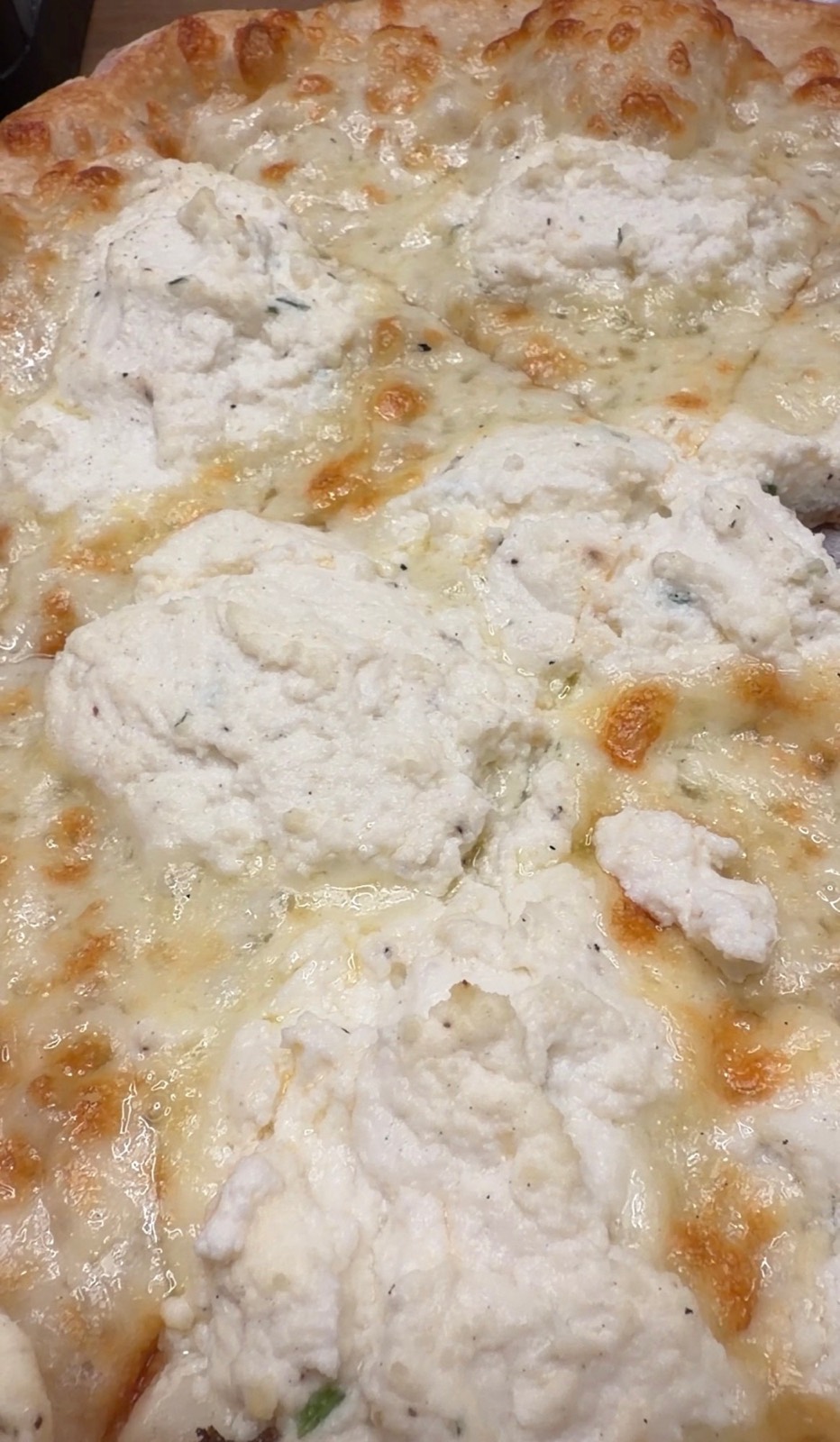 Sam's order: the 10-inch NY White pizza with dollops of ricotta over melted mozzarella