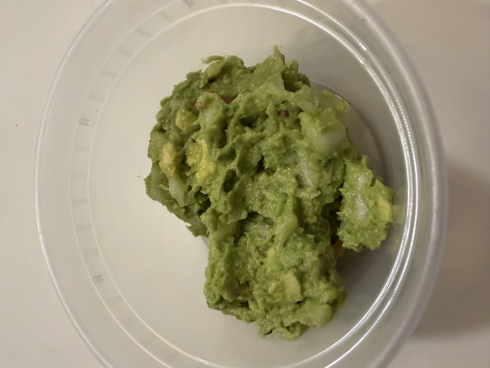 Sam's order: a container of guacamole from the Chips and Guac