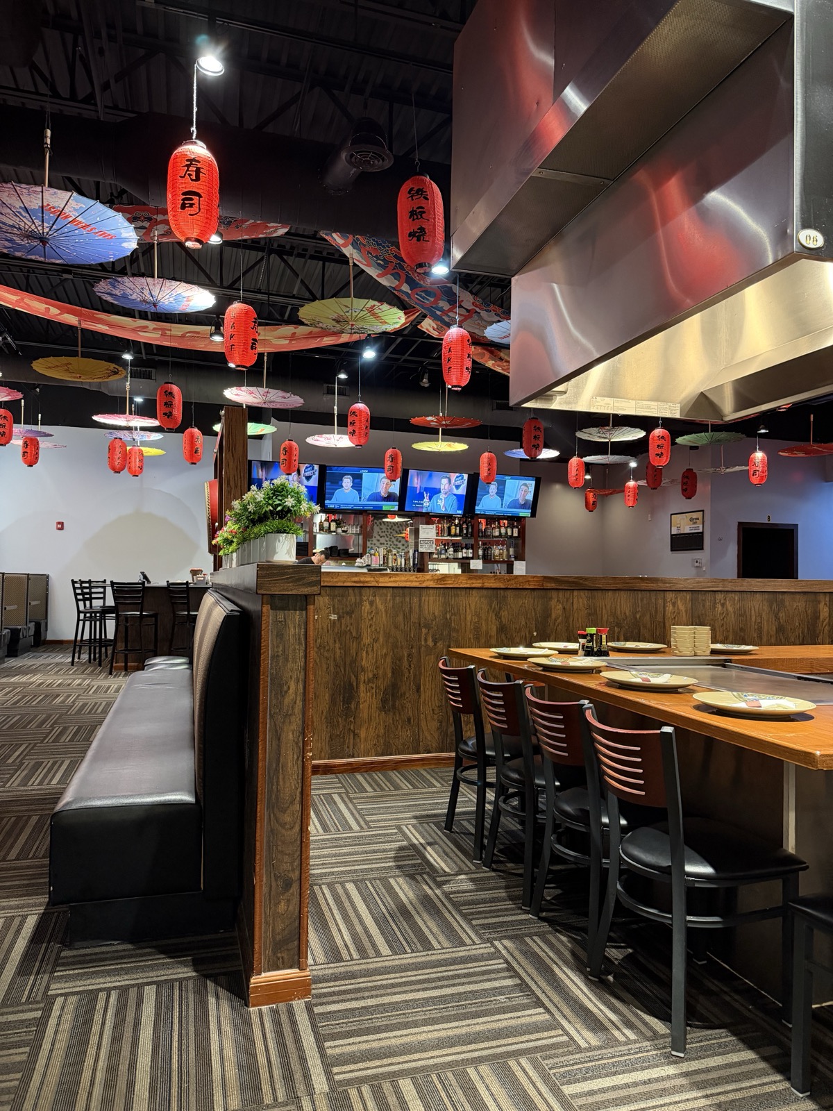 Inside Sake Steak House, dining room with lanterns and umbrellas