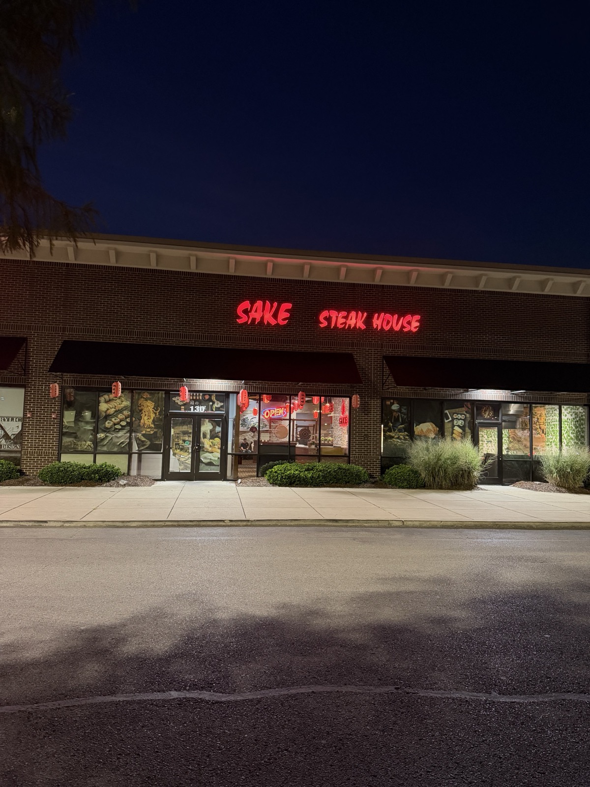 Sake Steak House storefront sign at night, Hendersonville