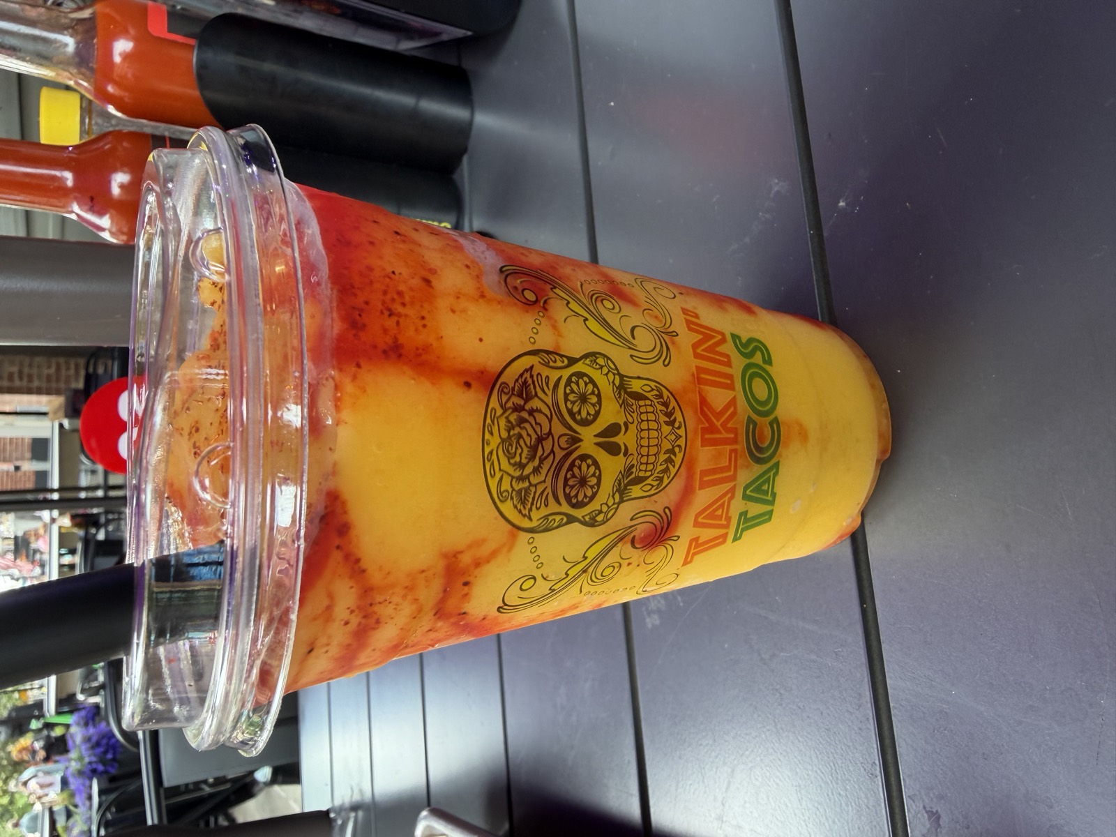 Sam's drink: the Mangodana, a mango and chamoy drink in a Talkin' Tacos cup