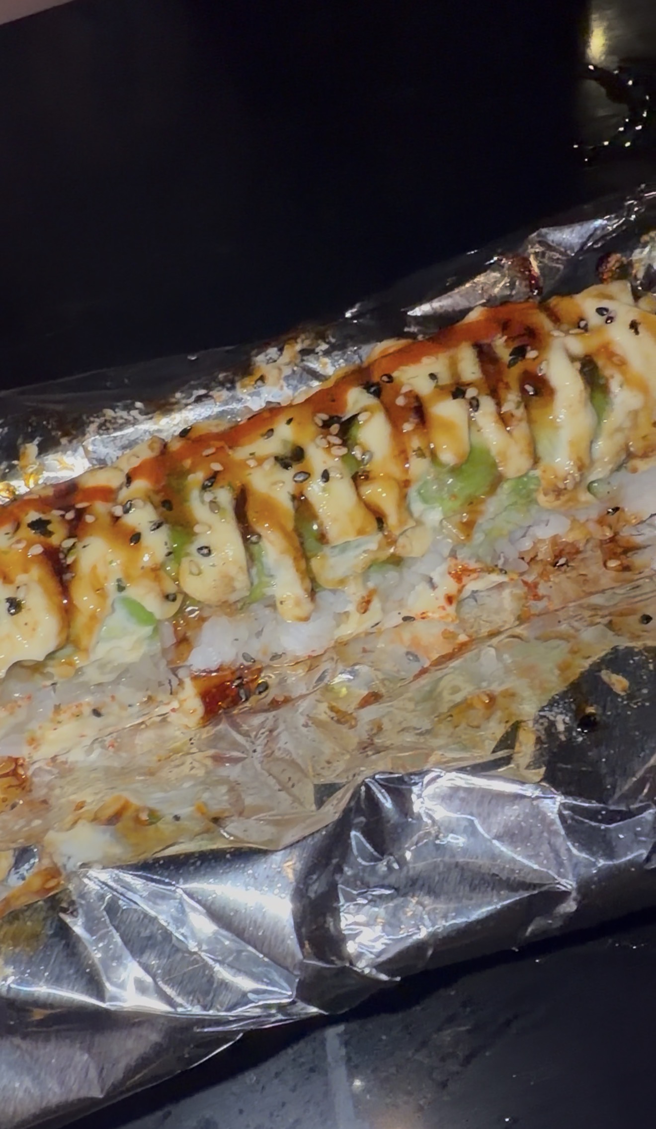 Sam's order: the Flaming Tiger Roll served in foil, Thai Samurai