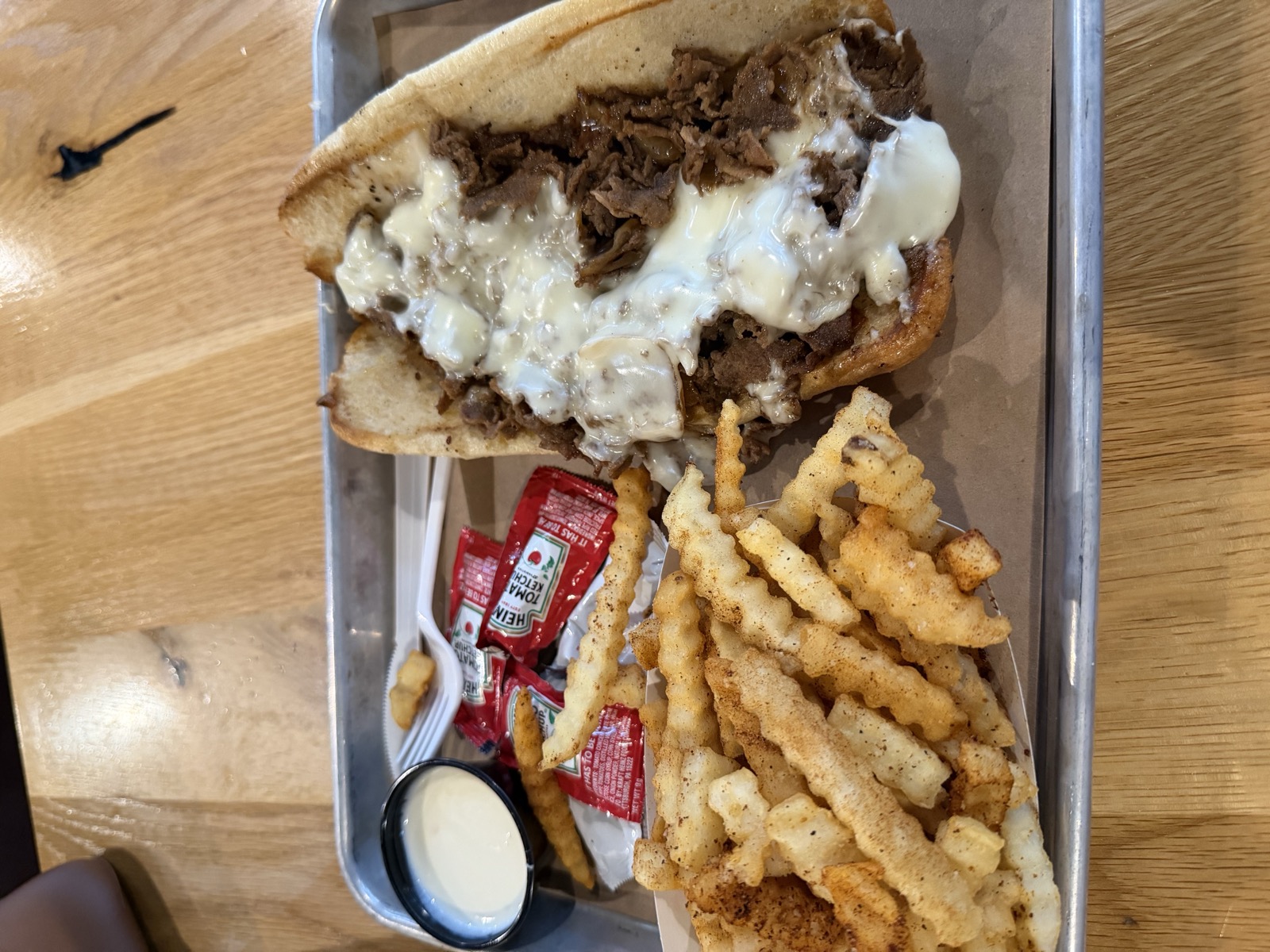 Sam's order: The Original cheesesteak with ribeye and white American, plus Cajun fries, The Philly Special